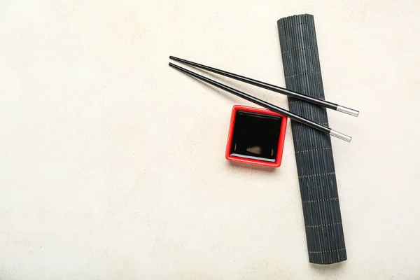 Red Bowl Soy Sauce Chopsticks Bamboo Mat White Background — Stockfoto