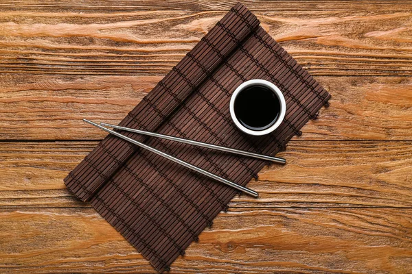 Bowl Soy Sauce Chopsticks Bamboo Mat Wooden Background — Stock Photo, Image