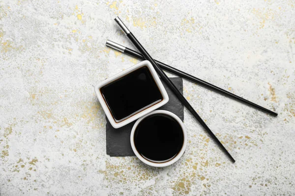 Bowls Soy Sauce Chopsticks Board Grunge Background — Stockfoto