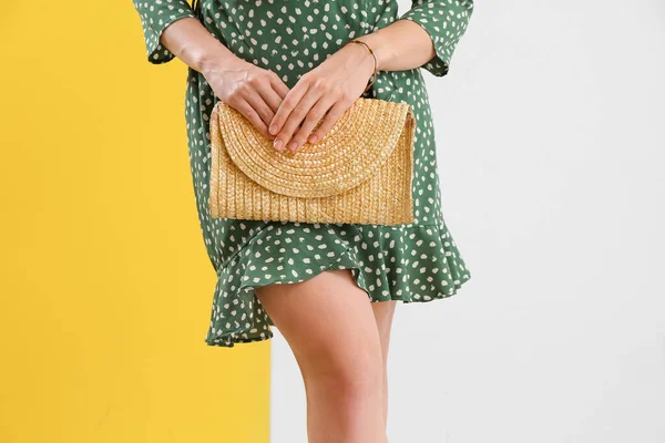 Woman Stylish Dress Holding Elegant Rattan Handbag Color Background Closeup — Foto Stock