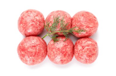Raw meat balls with dill on white background