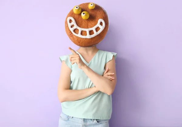 Woman Funny Monster Cookie Instead Her Head Lilac Background Halloween — Zdjęcie stockowe