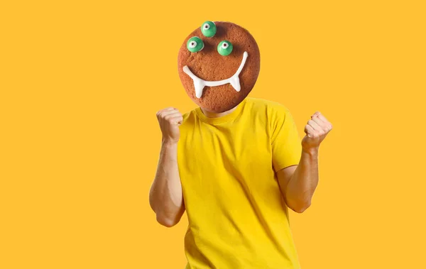 Happy Man Funny Monster Cookie Instead His Head Yellow Background — Fotografia de Stock