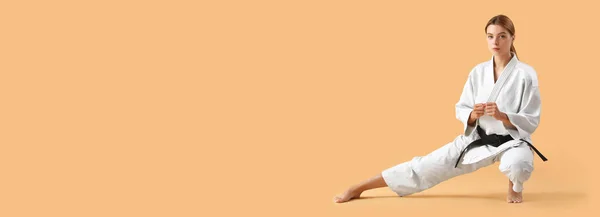 Young Woman Practicing Karate Beige Background Space Text — Stockfoto