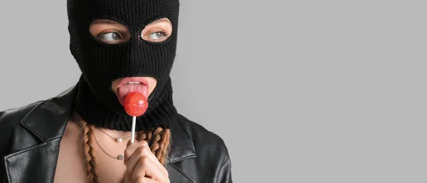 Young Woman Balaclava Lollipop Grey Background Space Text — Stockfoto