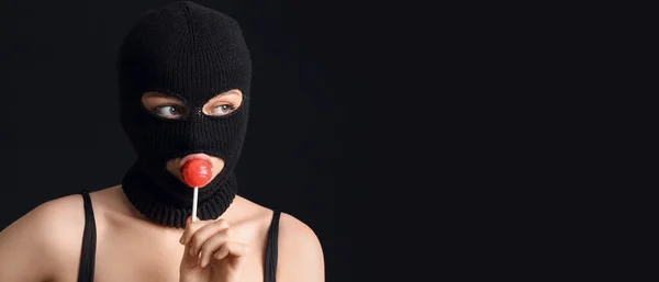Young Woman Balaclava Lollipop Black Background Space Text — Zdjęcie stockowe