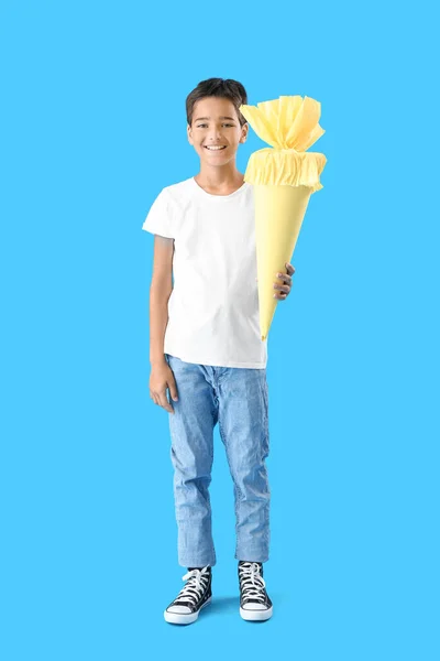 Little Boy Yellow School Cone Blue Background — Zdjęcie stockowe
