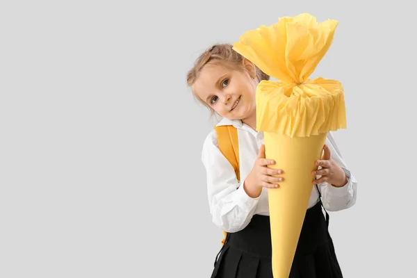 Cute Little Girl Yellow School Cone Light Background — Zdjęcie stockowe