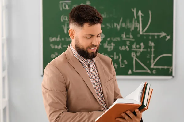 Handsome Math Teacher Reading Book Classroom — Stok Foto