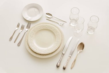 Set of stylish tableware on white background