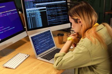 Transgender programmer working in server room
