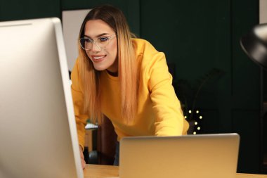 Transgender programmer working in server room