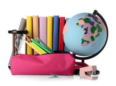 Pink pencil case with school stationery and hourglass on white background