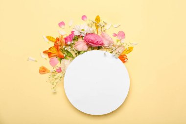 Blank paper sheet with beautiful flowers on beige background