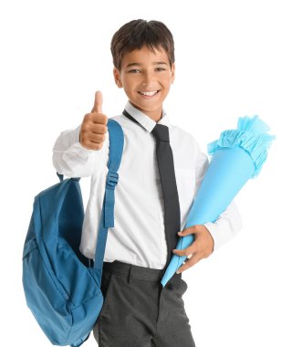 Little boy with school cone and backpack showing thumb-up on white background