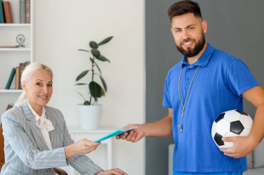 Teachers working in school office