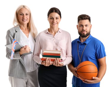 Teachers with UK flag, books and ball on white background
