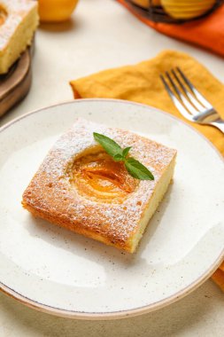 Plate with piece of tasty apricot pie, closeup