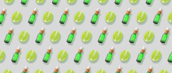 Many Bottles Lime Essential Oil Light Background Pattern Design — 图库照片