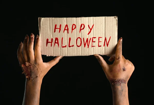 Hands Zombie Holding Cardboard Text Happy Halloween Black Background — Stockfoto
