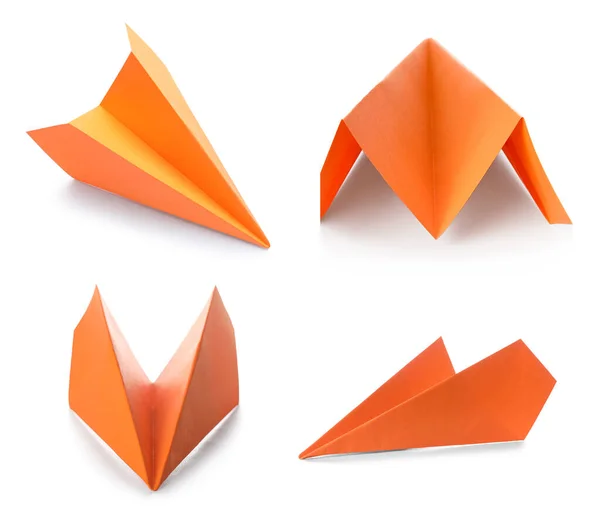 Set of orange paper plane isolated on white