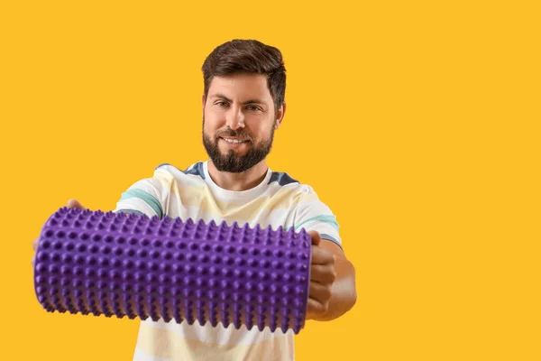 Young Man Foam Roller Yellow Background — Stok Foto