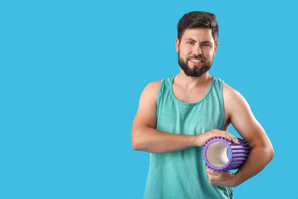 Young Man Foam Roller Blue Background — Foto de Stock