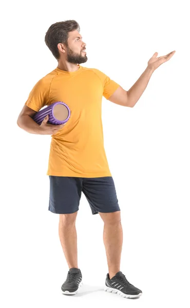 Young Man Foam Roller Showing Something White Background —  Fotos de Stock