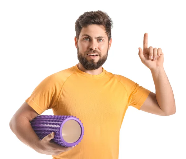 Young Man Foam Roller Pointing Something White Background — 스톡 사진