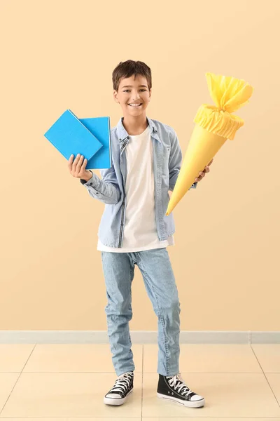 Little Boy Yellow School Cone Books Beige Background — Stock Fotó