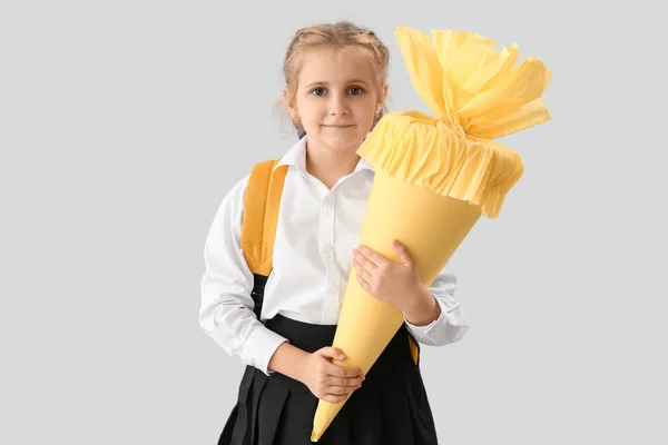 Cute Little Girl Yellow School Cone Light Background — Stockfoto