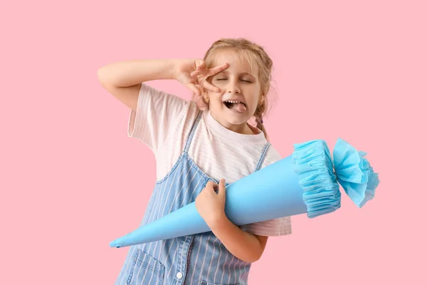 Cute Little Girl Blue School Cone Showing Victory Gesture Pink — Stockfoto