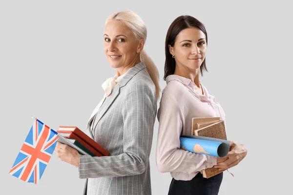 Female Teachers Flag Books Light Background — Fotografia de Stock