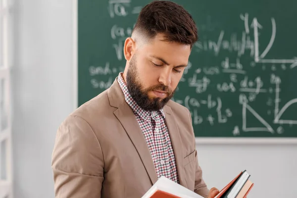 Handsome Math Teacher Reading Book Classroom — Stok Foto