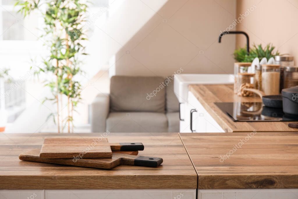 Cutting board on table top in stylish kitchen