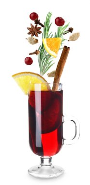 Glass cup of tasty mulled wine and ingredients on white background