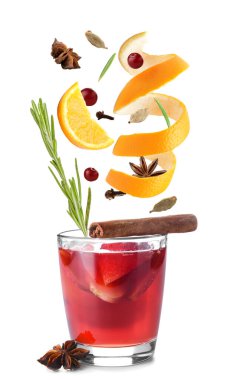 Glass of tasty mulled wine and ingredients on white background