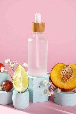 Composition with bottle of essential oil, fruits and plaster stands on color background, closeup
