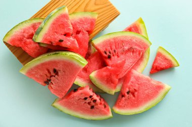 Slices of watermelon on blue background