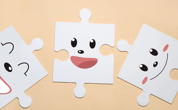 White Puzzle Pieces Different Drawn Emoticons Beige Background — Foto Stock