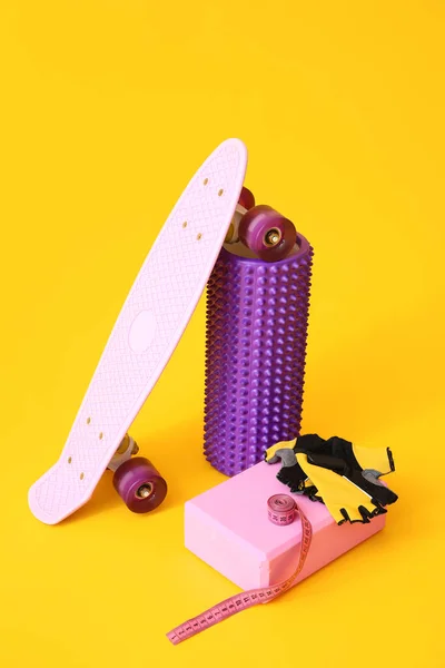 Foam Roller Skateboard Block Gloves Measuring Tape Yellow Background — Stockfoto