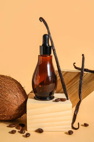 Composition with bottle of essential oil, coconut and vanilla sticks on color background