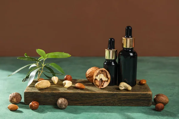 Wooden Board Bottles Essential Oil Nuts Table — Stock Photo, Image