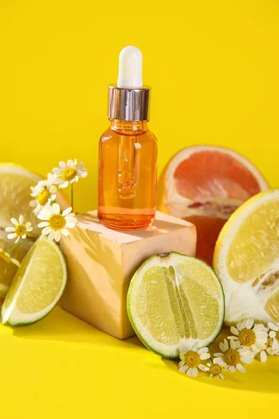 Composition Bottle Essential Oil Citrus Fruits Chamomile Flowers Yellow Background — Stockfoto