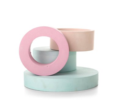 Different decorative podiums for presentation of cosmetic products on white background