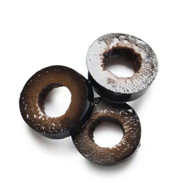 Slices of tasty black olives isolated on white background