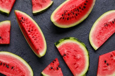 Slices of watermelon on dark background