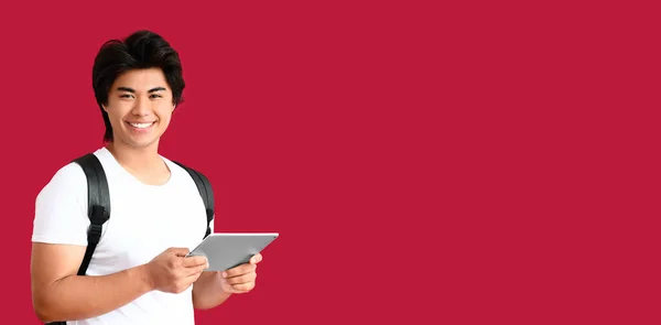 Happy Young Asian Man Holding Tablet Computer Red Background Space — Stock Photo, Image