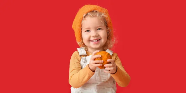 Cute Little Girl Pumpkin Red Background — Stockfoto