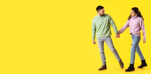 Going Young Couple Autumn Sweaters Yellow Background Space Text — Foto de Stock